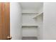 Walk-in closet featuring shelving and hanging rods at 3961 S Uravan St, Aurora, CO 80013