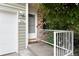 Inviting home entrance featuring a charming porch and freshly painted railing at 3961 S Uravan St, Aurora, CO 80013