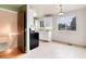 Well-lit kitchen featuring new appliances and tile flooring at 3961 S Uravan St, Aurora, CO 80013