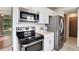 Kitchen featuring stainless steel appliances and ample counter space at 3961 S Uravan St, Aurora, CO 80013