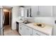 A kitchen featuring stainless steel appliances, white cabinets, and a window at 3961 S Uravan St, Aurora, CO 80013