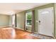 Bright living room featuring beautiful hardwood floors and abundant natural light at 3961 S Uravan St, Aurora, CO 80013