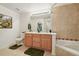 This bathroom features a soaking tub, double sinks and toilet for maximum convenience at 5800 Tower Rd # 1201, Denver, CO 80249