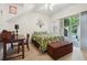 This bright bedroom offers an outdoor patio and features a desk with chair at 5800 Tower Rd # 1201, Denver, CO 80249