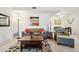 Comfortable living room with hardwood-style floors and a dining area in the background at 5800 Tower Rd # 1201, Denver, CO 80249