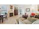 Cozy living room with a fireplace, tile floors and comfortable seating at 5800 Tower Rd # 1201, Denver, CO 80249