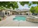 Community pool and clubhouse area with ample seating, perfect for residents to relax and socialize during the warmer months at 5800 Tower Rd # 1201, Denver, CO 80249