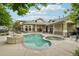 Community pool and clubhouse with seating areas, providing residents with a comfortable and enjoyable recreational space at 5800 Tower Rd # 1201, Denver, CO 80249