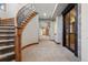 Open basement area with staircase, neutral carpet, brick accents and good lighting at 2102 Shoreside Dr, Berthoud, CO 80513