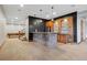Finished basement with a stylish brick bar, mini-fridge, glass shelving, and recessed lighting at 2102 Shoreside Dr, Berthoud, CO 80513
