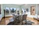 Bright dining room features hardwood floors, large windows, and contemporary decor at 2102 Shoreside Dr, Berthoud, CO 80513