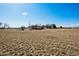 Distant view of large home with a courtyard surrounded by a field at 2102 Shoreside Dr, Berthoud, CO 80513