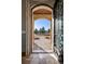 Stone archway with decorative iron door leads to stone walkway at 2102 Shoreside Dr, Berthoud, CO 80513