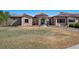 Charming front exterior with stone accents, manicured lawn, and a welcoming entrance at 2102 Shoreside Dr, Berthoud, CO 80513