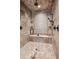 Elegant bathroom with a glass enclosed, tiled shower and spa fixtures at 2102 Shoreside Dr, Berthoud, CO 80513