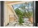 Inviting balcony with street views, featuring two wooden chairs for relaxing outdoors at 4876 E Kentucky Ave # F, Denver, CO 80246