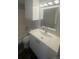 Modern bathroom with new vanity, mirror, and lighting at 4876 E Kentucky Ave # F, Denver, CO 80246