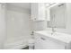 Clean bathroom with a tub, a stylish vanity, and ample storage space at 4876 E Kentucky Ave # F, Denver, CO 80246