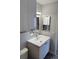 Stylish bathroom with modern vanity, mirror, and fixtures at 4876 E Kentucky Ave # F, Denver, CO 80246