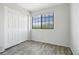 Bright bedroom with closet and a window letting in natural light and tree views at 4876 E Kentucky Ave # F, Denver, CO 80246