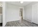 Bright bedroom with vinyl flooring, featuring an open doorway and closet for ample storage at 4876 E Kentucky Ave # F, Denver, CO 80246