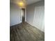 Comfortable bedroom with hardwood floors and neutral paint at 4876 E Kentucky Ave # F, Denver, CO 80246