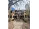 Multi-level condo with walkway and patio, neutral siding with dark window trim at 4876 E Kentucky Ave # F, Denver, CO 80246