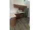 Kitchen featuring wood cabinets and stainless steel appliances at 4876 E Kentucky Ave # F, Denver, CO 80246