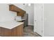 Modern kitchen with stainless steel appliances and wood cabinets, with vinyl flooring at 4876 E Kentucky Ave # F, Denver, CO 80246