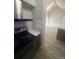 Modern kitchen space with stainless steel appliances and a vaulted ceiling at 4876 E Kentucky Ave # F, Denver, CO 80246