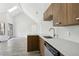 Contemporary kitchen featuring a quartz countertop, an undermount sink, and modern stainless steel appliances at 4876 E Kentucky Ave # F, Denver, CO 80246