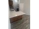 Modern kitchen with island, pendant lighting, and stainless steel appliances at 4876 E Kentucky Ave # F, Denver, CO 80246