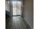 Living room featuring large windows, hardwood floors, and bright light at 4876 E Kentucky Ave # F, Denver, CO 80246