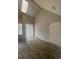 Bright living room with vaulted ceiling, skylight, hardwood floors, and neutral paint at 4876 E Kentucky Ave # F, Denver, CO 80246
