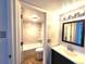 Bathroom featuring a marble tile surround shower and a vanity at 1020 15Th St # 25D, Denver, CO 80202
