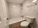 Clean bathroom with tiled walls, a bathtub, and modern fixtures at 1020 15Th St # 25D, Denver, CO 80202