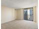 Bright bedroom with a large window offering cityscape views, and neutral walls at 1020 15Th St # 25D, Denver, CO 80202