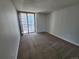 Bedroom offering neutral carpeting and a balcony overlooking the cityscape at 1020 15Th St # 25D, Denver, CO 80202