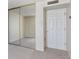 This bedroom features carpet and a mirrored closet at 1020 15Th St # 25D, Denver, CO 80202