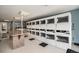Bright laundry room with multiple washers and dryers and folding table at 1020 15Th St # 25D, Denver, CO 80202