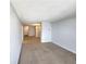 Open-concept room with carpeting featuring views into the living room and kitchen at 1020 15Th St # 25D, Denver, CO 80202