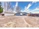 Backyard with detached garage and patio area with a privacy fence at 11367 Fowler, Northglenn, CO 80233