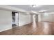 Spacious finished basement with light wood flooring and neutral walls at 11367 Fowler, Northglenn, CO 80233
