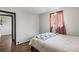 Comfortable bedroom featuring hardwood floors, and neutral paint at 11367 Fowler, Northglenn, CO 80233