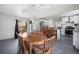 Open concept dining area with a view into the kitchen and access to the back yard via sliding glass doors at 11367 Fowler, Northglenn, CO 80233