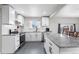 Well-lit kitchen featuring white cabinets, granite counters, subway tile backsplash, and stainless steel appliances at 11367 Fowler, Northglenn, CO 80233