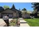 Charming home featuring a brick facade, a well-manicured lawn, and a mailbox at 10226 E Fair Pl, Englewood, CO 80111