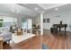 Cozy living room featuring hardwood floors, comfortable seating, and a sliding glass door to the outdoors at 10226 E Fair Pl, Englewood, CO 80111