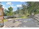 Large backyard wooden deck area with seating and views of the surrounding landscape at 55 Two Moon Rd, Idaho Springs, CO 80452