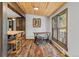 Charming dining area with wood floors, a large window, and cozy seating at 55 Two Moon Rd, Idaho Springs, CO 80452